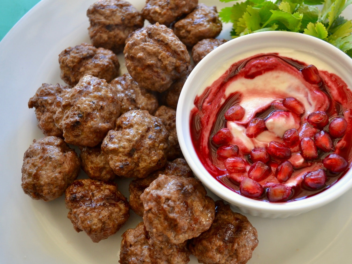 Mediterranean-Spiced Meatballs with Pomegranate Yogurt Sauce